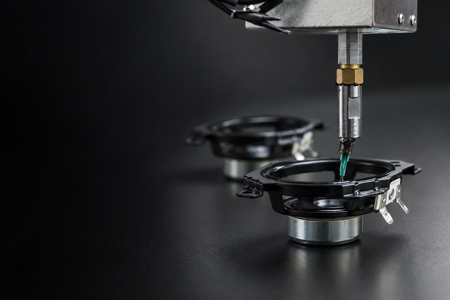 Automatic adhesive dispensing on a driver