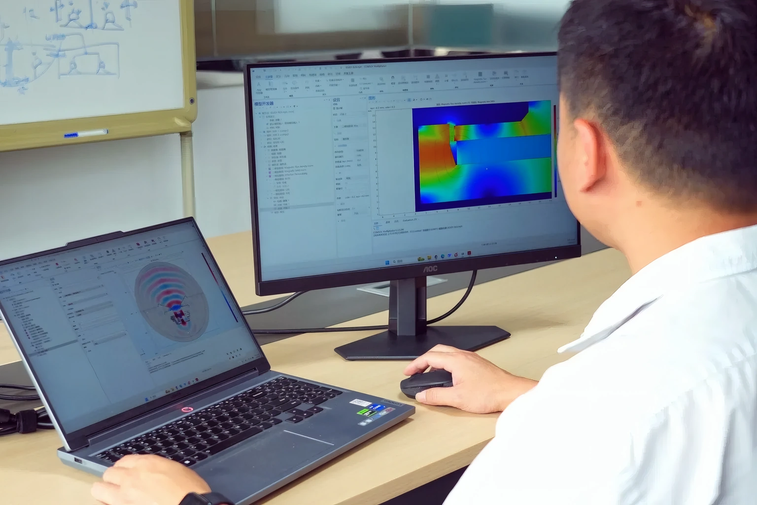 Engineer reviewing a COMSOL simulation of a loudspeaker motor
